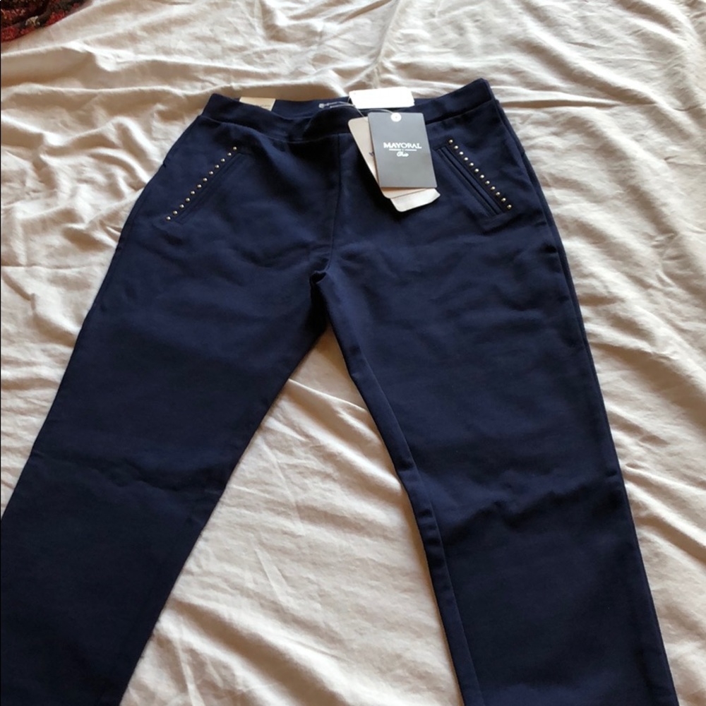 Blue pants with gold button pockets